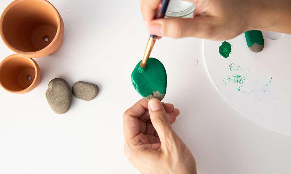 Painting cactus on stones