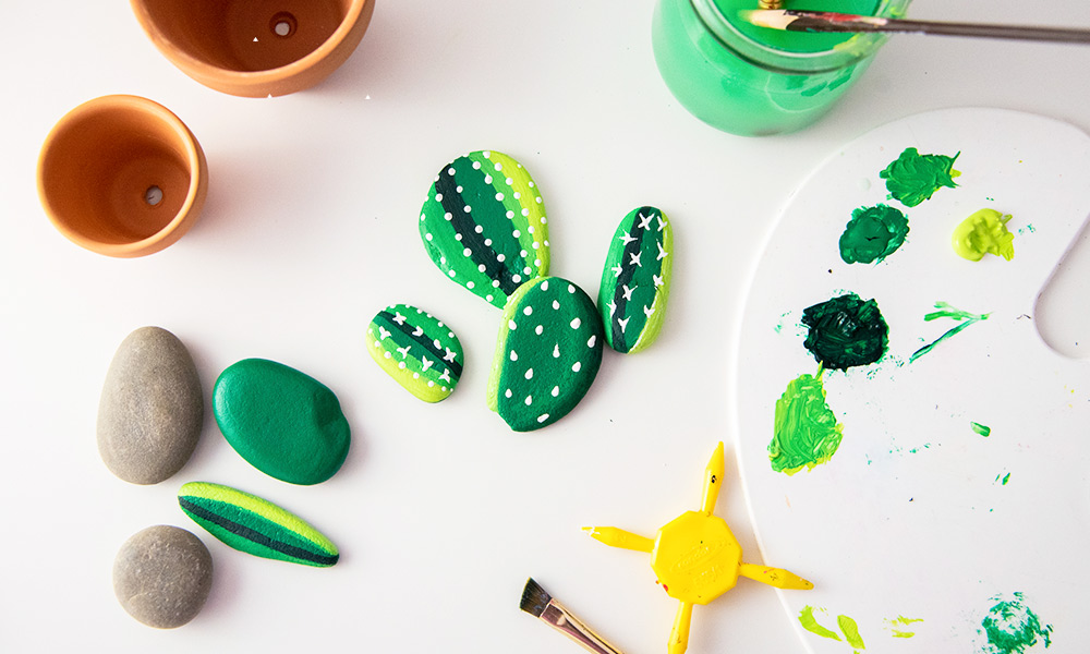 Painting cactus on stones